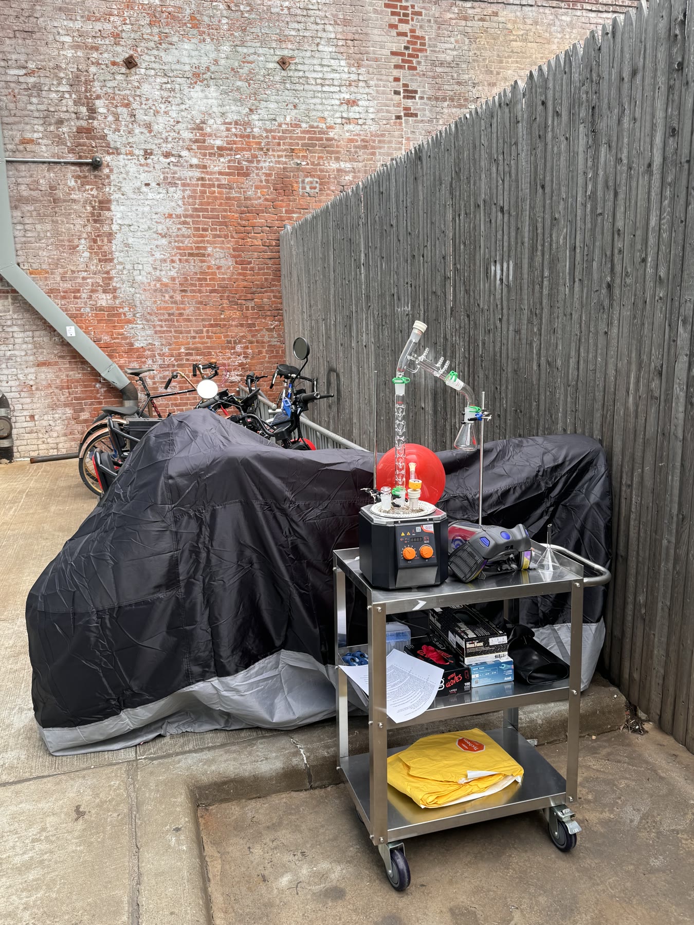 Covered equipment and a small benchtop setup outdoors