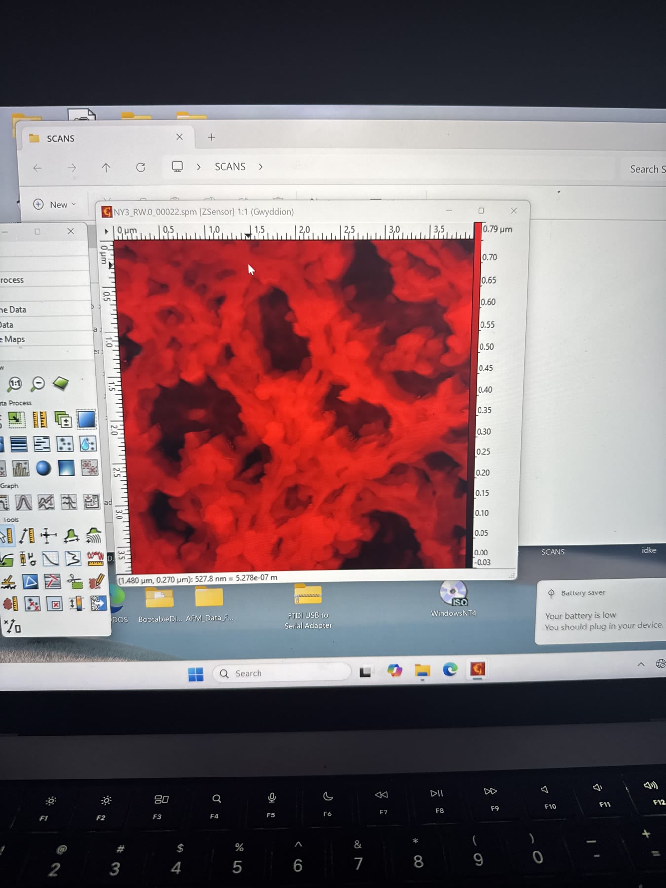Red microscopy image displayed on an instrument monitor