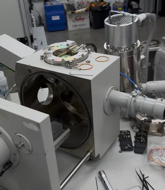 Open field-emission scanning electron microscope chamber during repair