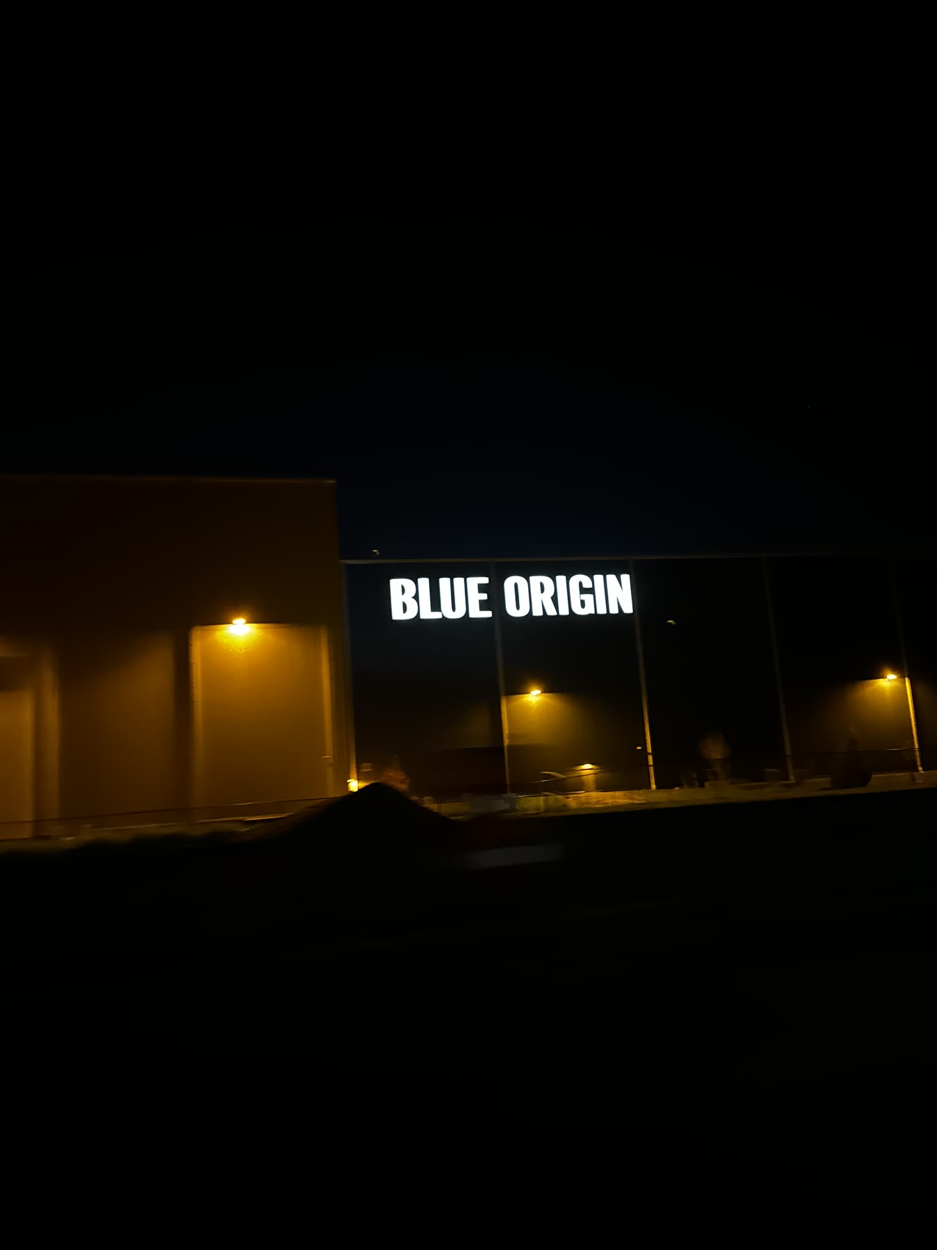 Blue Origin sign illuminated at night