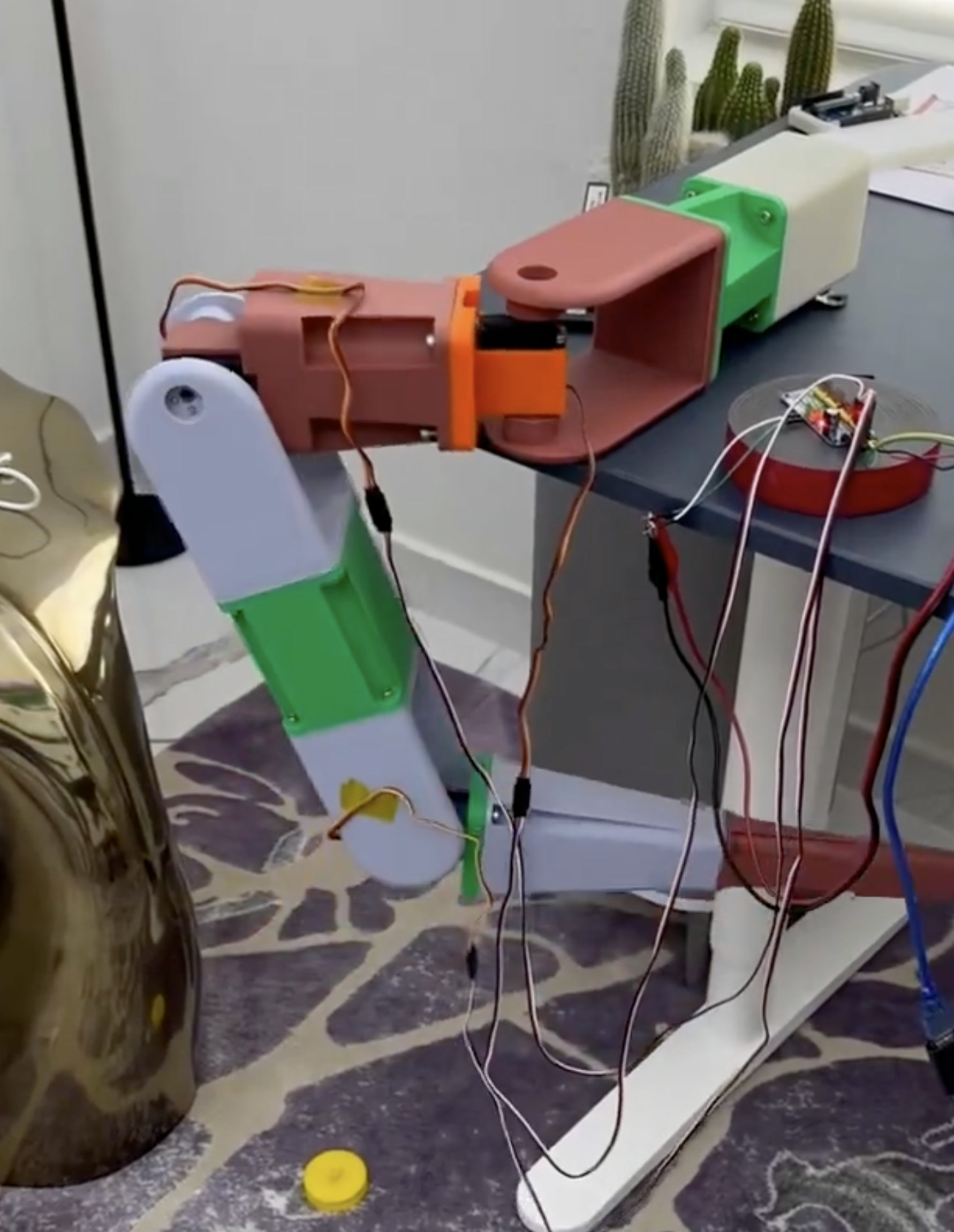 Articulated 3D-printed arm mechanism under electrical test