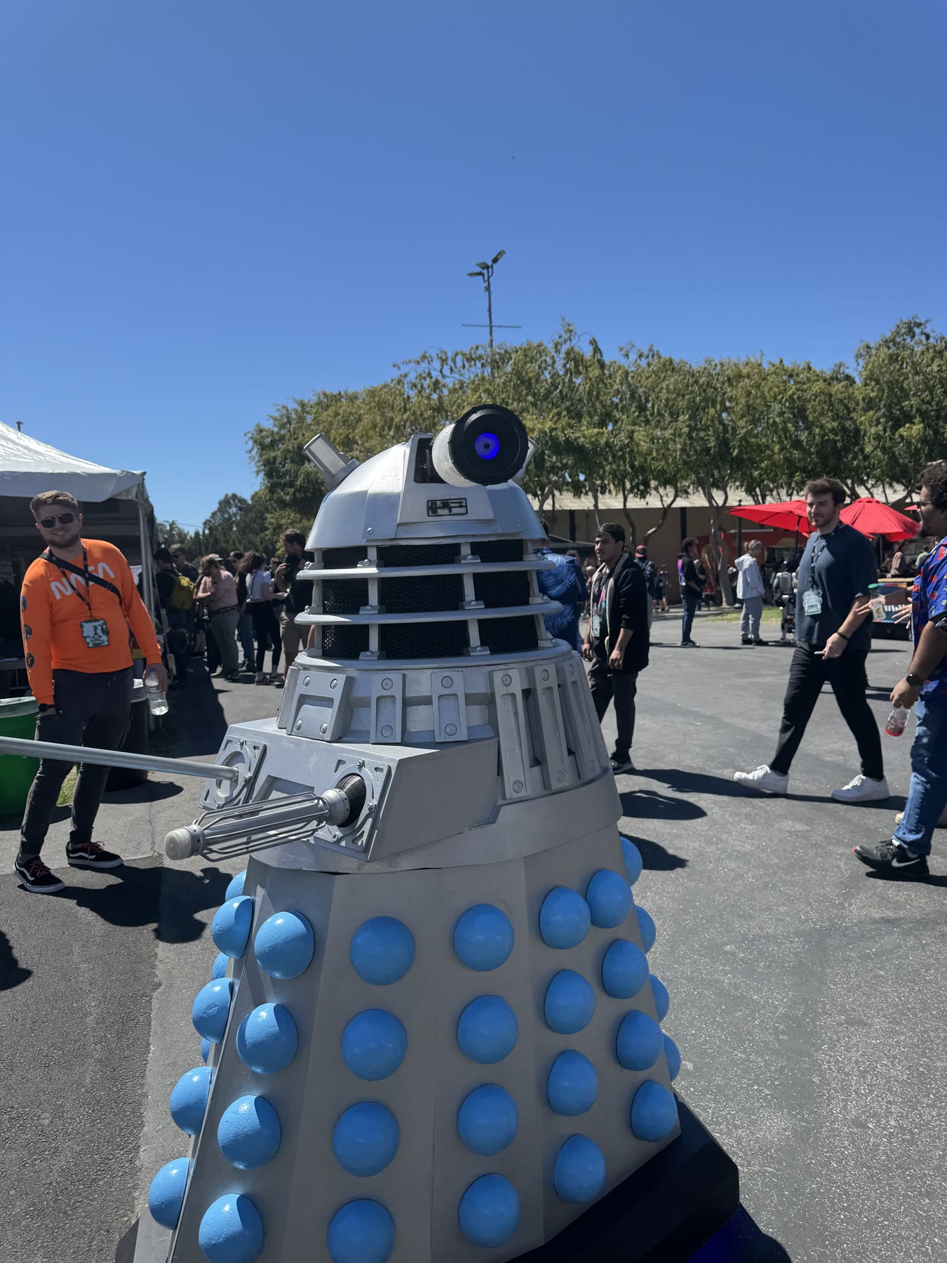 Homebuilt Dalek robot moving through the Open Sauce crowd