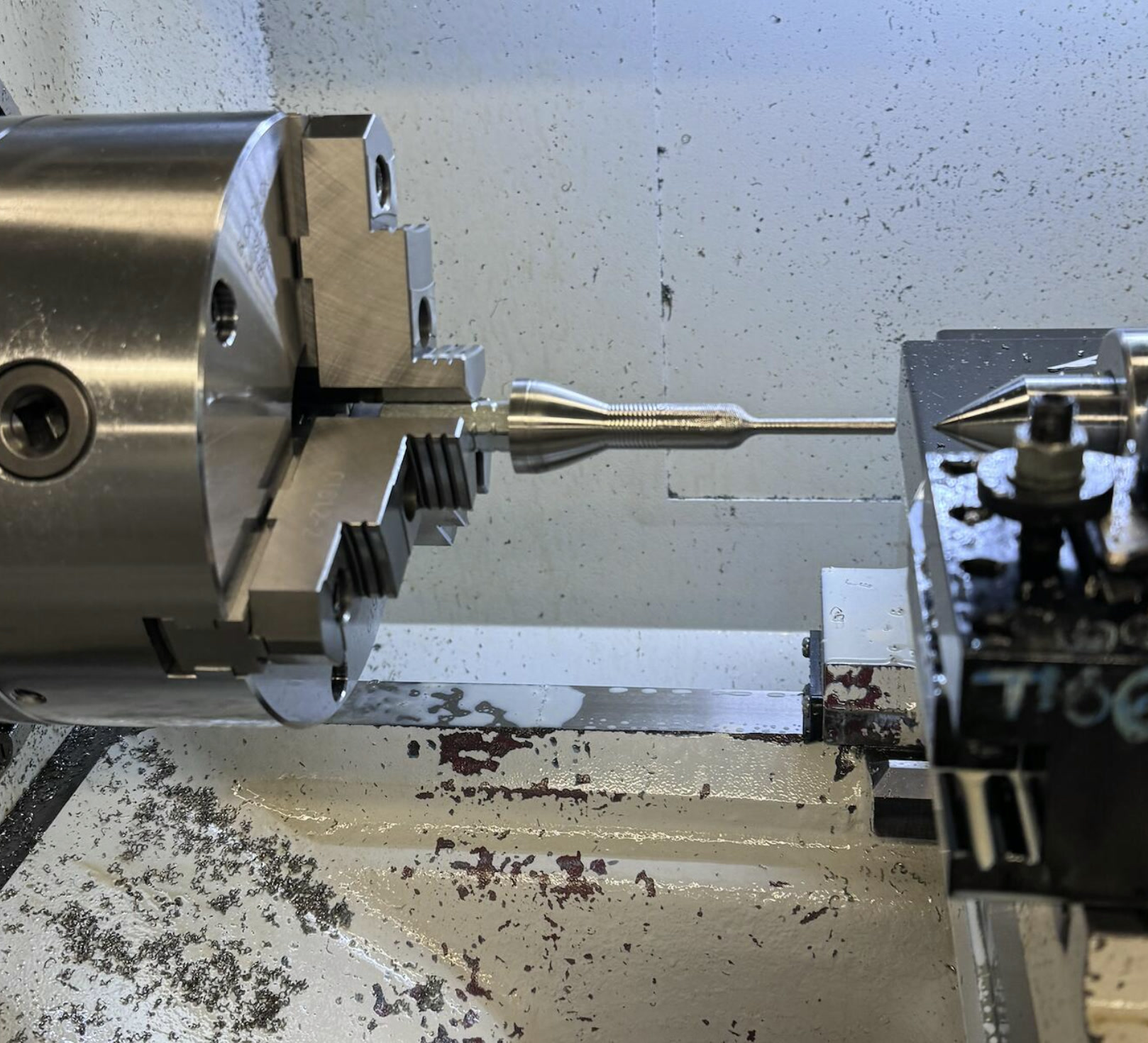 Sonotrode being machined between centers on a lathe